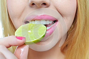 Young woman with sliced lime