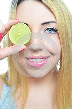 Young woman with sliced lime