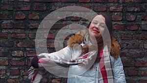 Young woman smile face on brick wall background