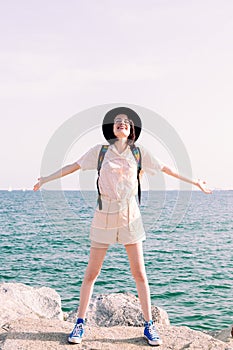 Young woman smiling free and happy with open arms