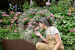 Young woman is smiling in her flower shop , small business concept