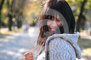 Young woman smiling outdoors