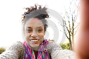 Young woman smiling and talking a selfie