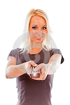 Young woman smiling with TV remote control