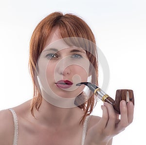 Young woman smoking a pipe