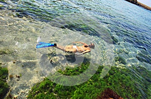 Young woman snorkeling in sea