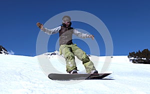 Young woman on a snowboard