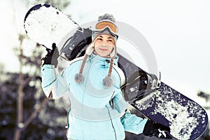 Young woman with snowboard