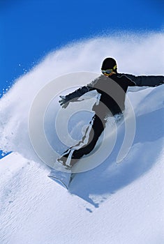 Young woman snowboarding