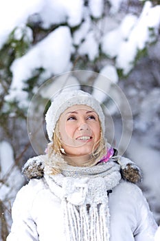 Young woman in snowy forest