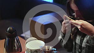 Young woman snuffs chinese tea leaves in plate. Traditional eastern chinese tea ceremony.