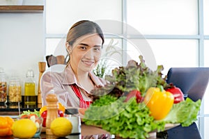 Young woman social media influencer teaching cooking Vegan food