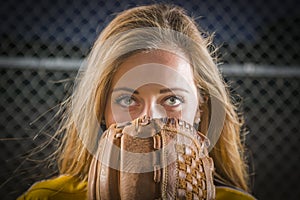 Young Woman with Softball Glove Covering Her Face Outdoors