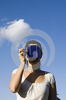 Young woman with a solar cell