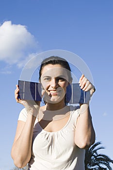 Young woman with a solar cell