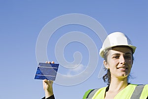 Young woman with a solar cell