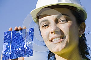 Young woman with a solar cell