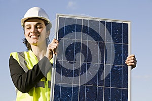 Young woman with a solar panel