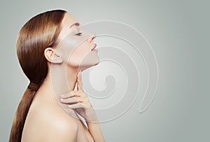 Young woman spa model with clear skin on white background. Facial treatment, aesthetic medicine and cosmetology concept