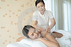 Young Woman during Spa Salon Body massage Hands Treatment