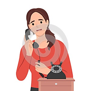 Young woman speak on old corded phone at home. Female have conversation on landline telephone. Communication and call