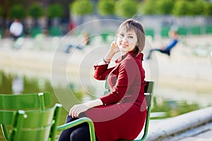 Young woman in Tuileries garden of Paris, France