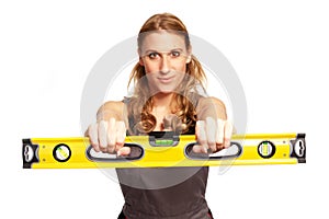 Young woman with a spirit level