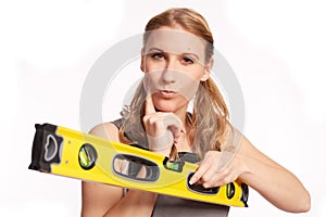 Young woman with a spirit level