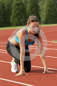 Young Woman in Sports Bra in Starting Position