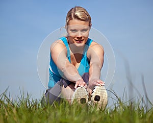 Young woman in sports wear outside