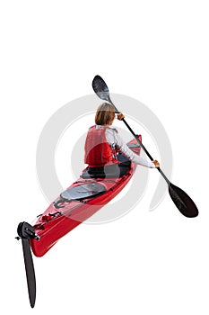 Young woman, sportsman in red canoe, kayak with a life vest and a paddle isolated on white background. Concept of sport