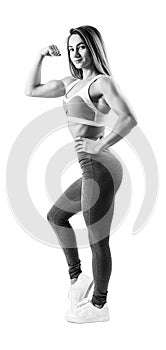 Young woman in sportswear demonstrated her beautiful muscular athletic body.