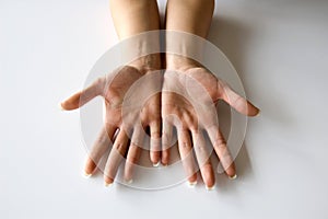 Young woman spread fingers on hands