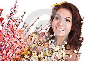 Young woman with spring flower and butterfly.