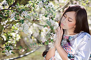 Young woman with spring flowers