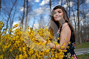 Young woman in the spring in park