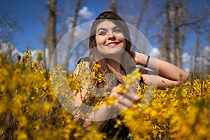 Young woman in the spring in park