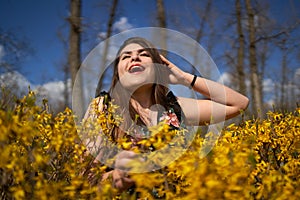 Young woman in the spring in park