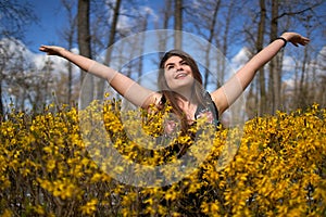 Young woman in the spring in park