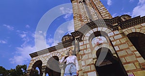 Young Woman on Stairs in Front of Orthodox Church, Downtown Belgrade Serbia
