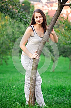 Young woman standing on green grass