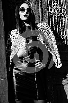 Young woman standing outdoors. fashion portrait. Black and white