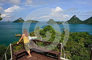 Young woman standing at overlook, Mae Koh island, Ang Thong National Marine Park, Thailand