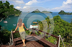 Young woman standing at overlook, Mae Koh island, Ang Thong National Marine Park, Thailand