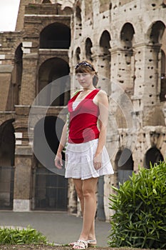 Young woman stands near Coliseum