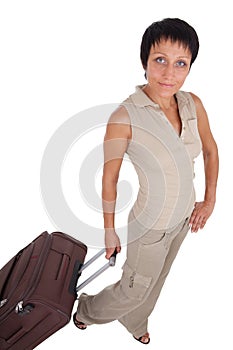 Young woman stands with traveling suitcase isolate