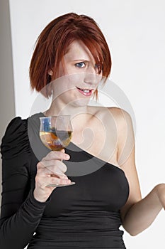 Young Woman Stares Holding Her Glass of Wine