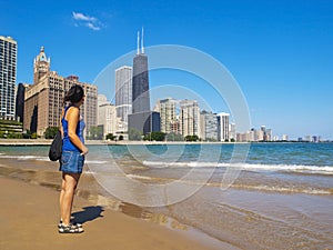 Young woman staring at the Chicago Skyline