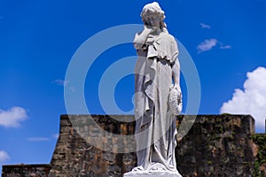 Young Woman Statue with Hand on Cheek