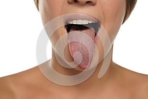 Young woman sticking out her tongue